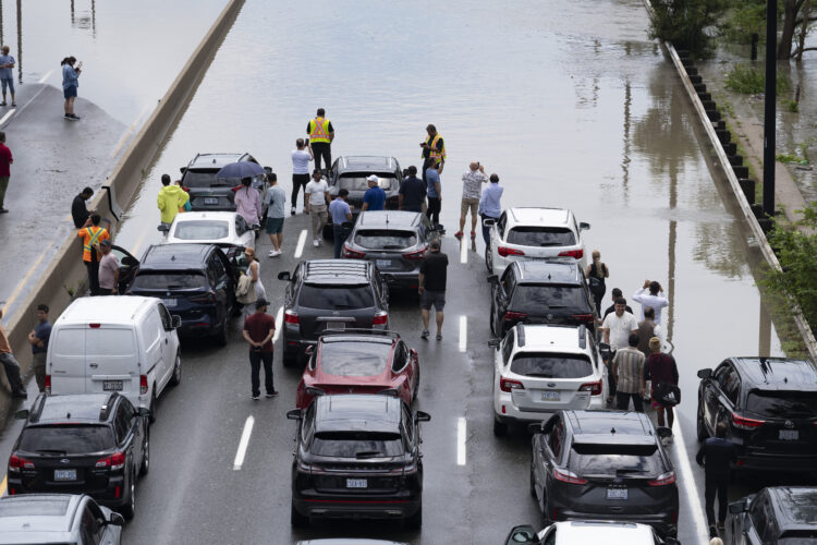 A major highway is flooded as rains hit Canada’s largest city